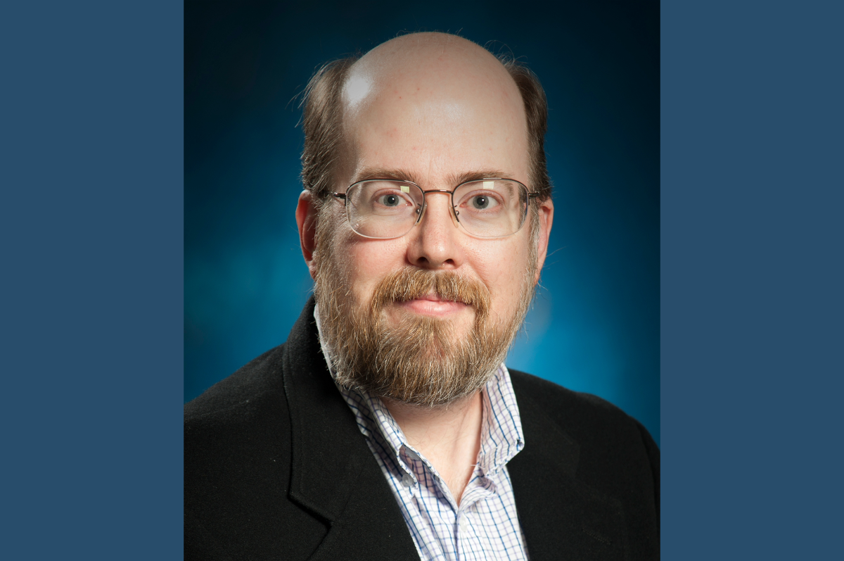 Portrait of man with glasses and a beard